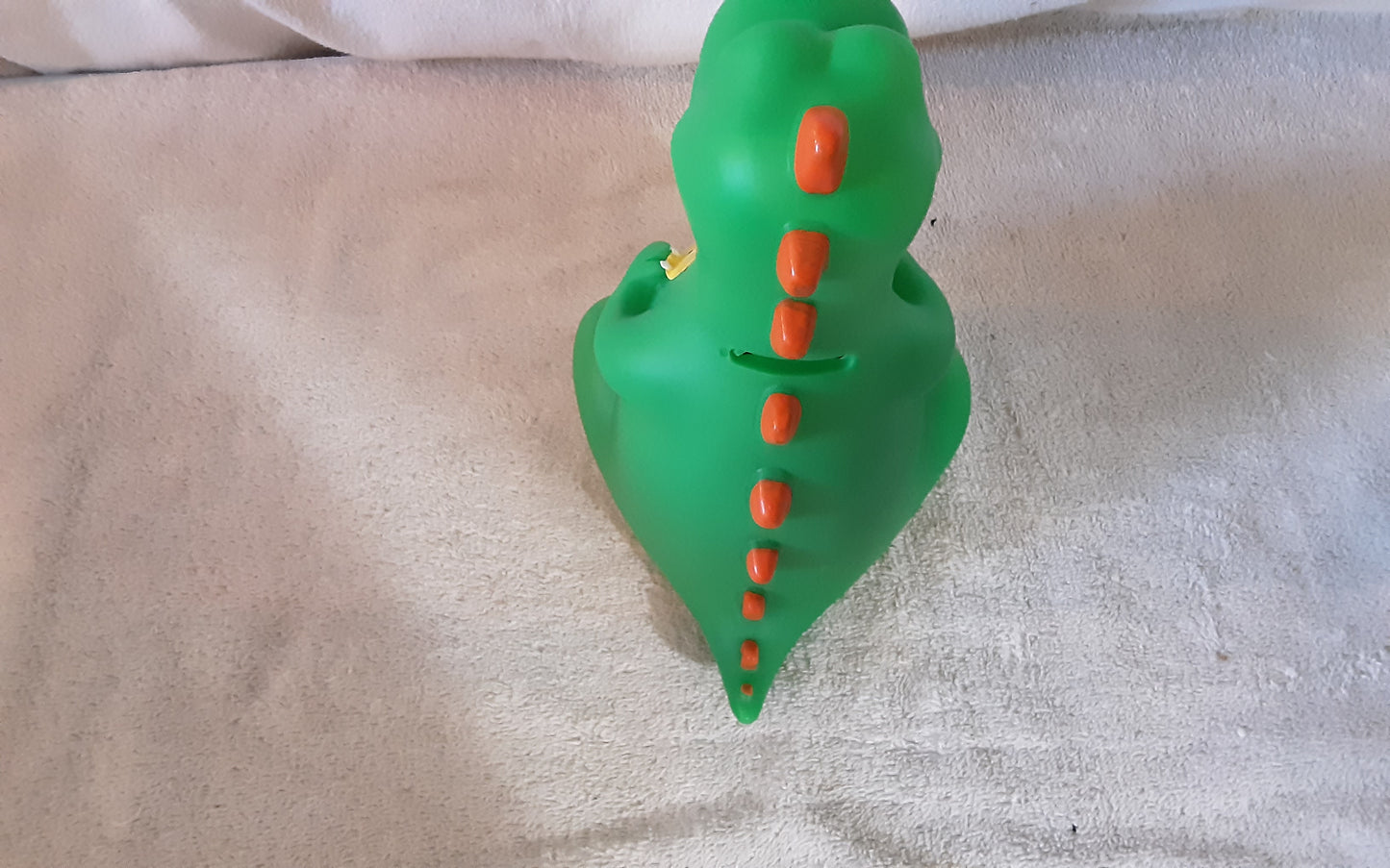 Dinosaur coin bank