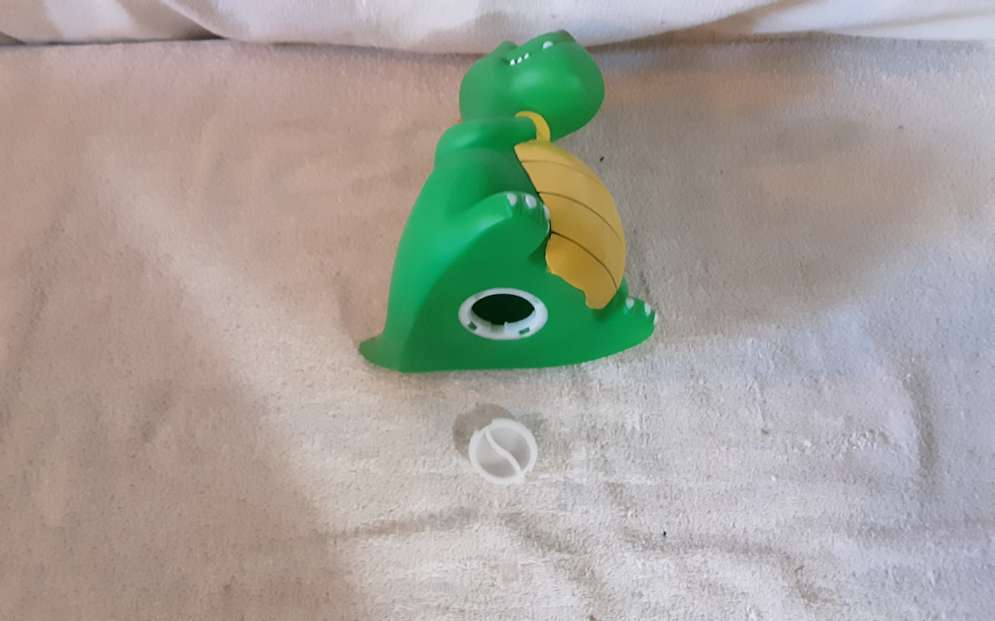 Dinosaur coin bank